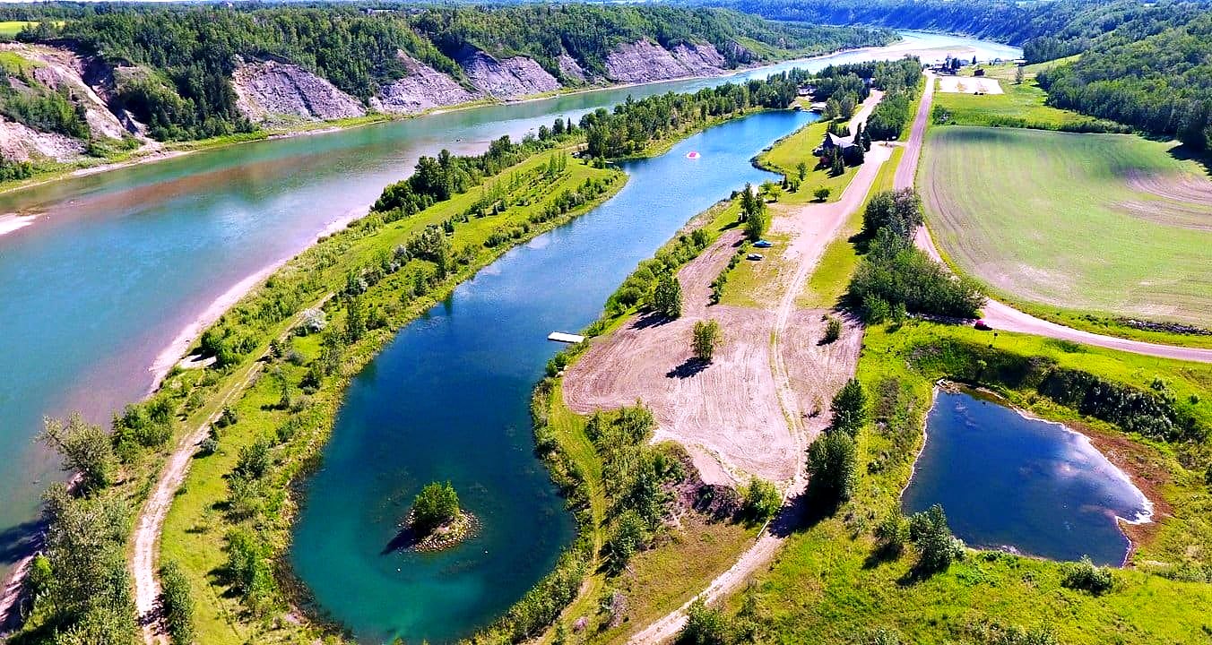 The lake and the river valley from the air, the long straight water set among the trees